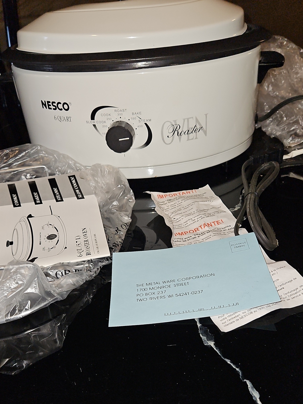 Nesco Cream and Black Roaster Oven with Front Dial